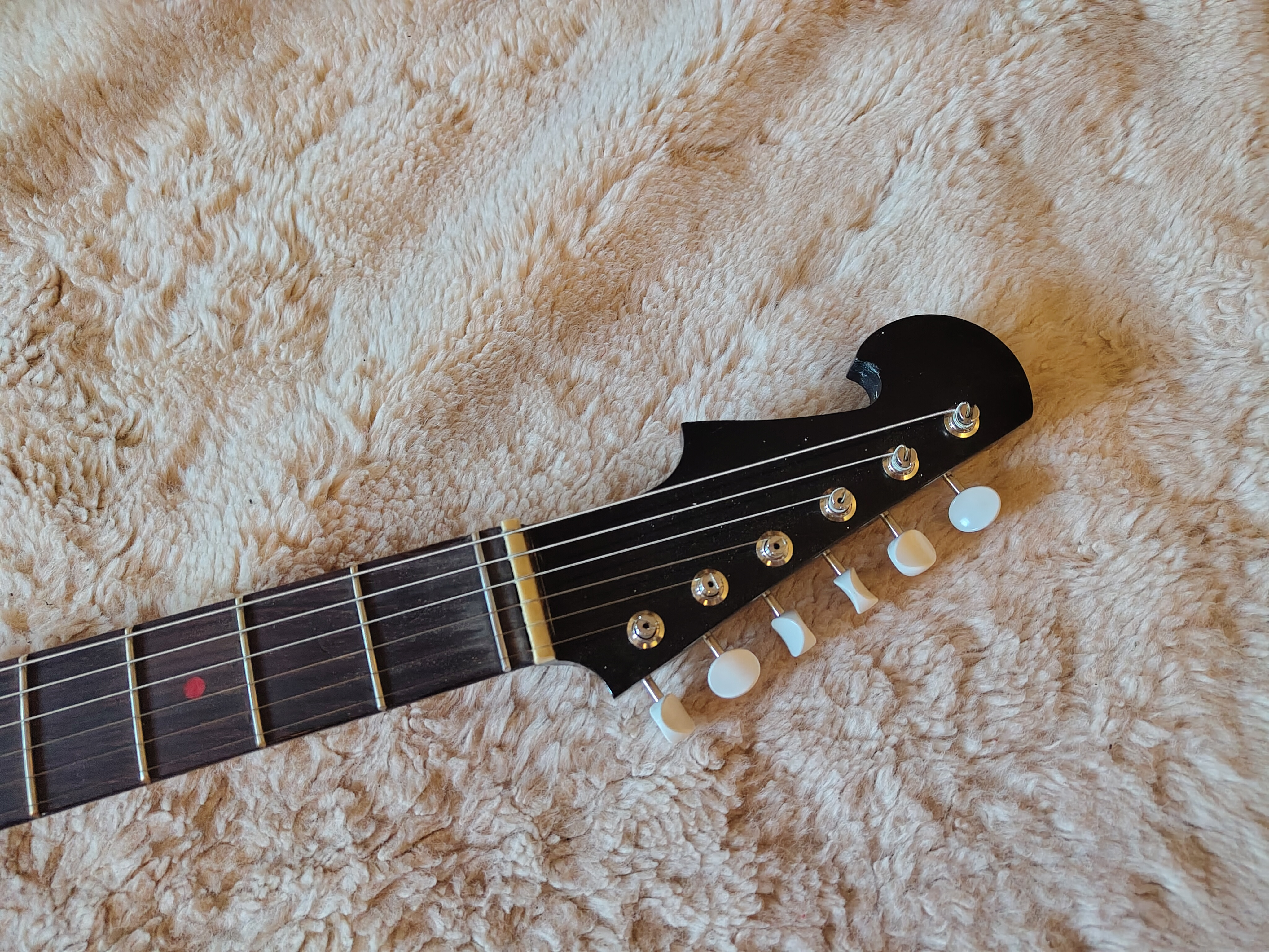 Moontide Tidal Wave Headstock close up, red dot inlays, dyed cherry